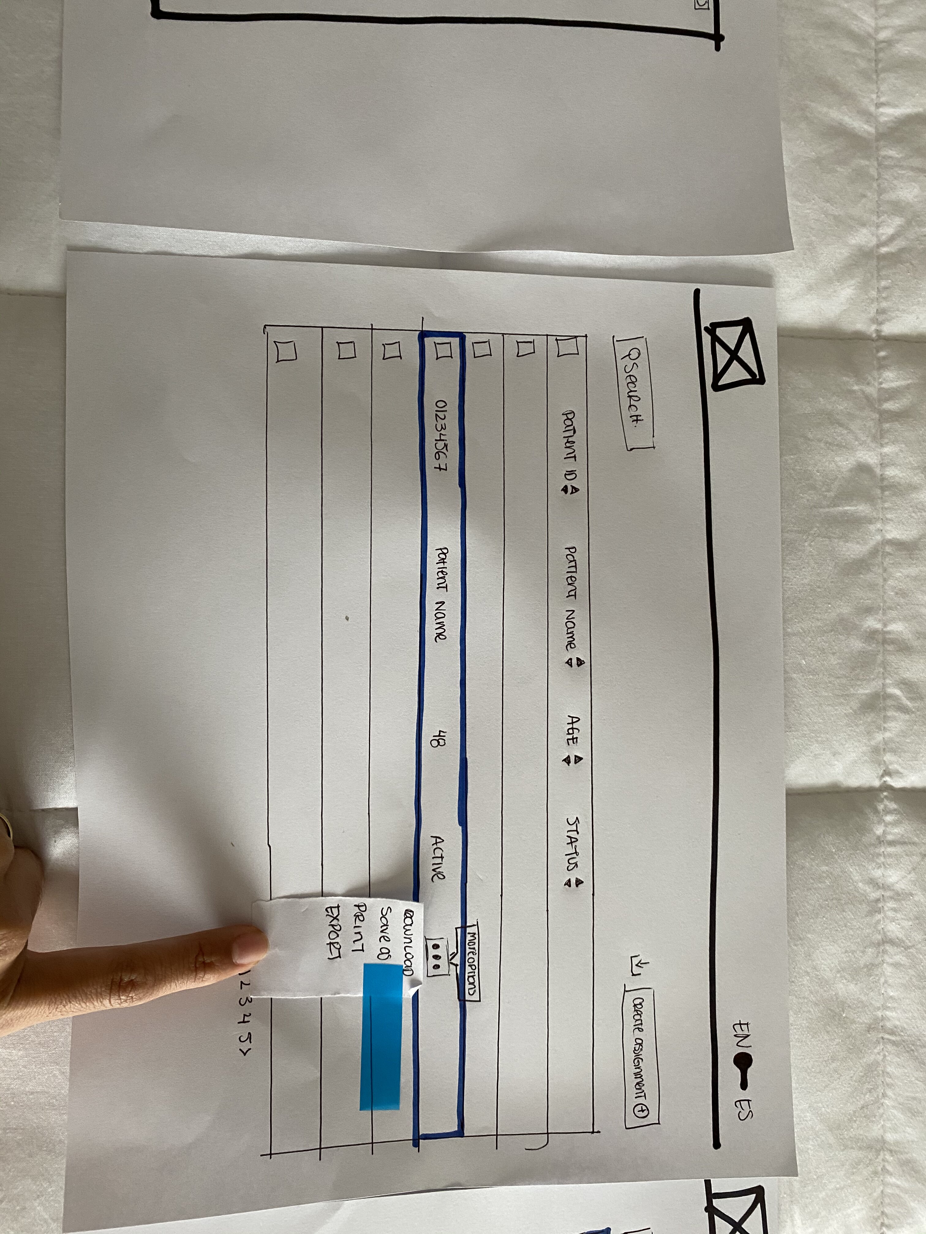 Paper wireframes helped explore the structure and key interactions, like row actions and language switching, before visual design.